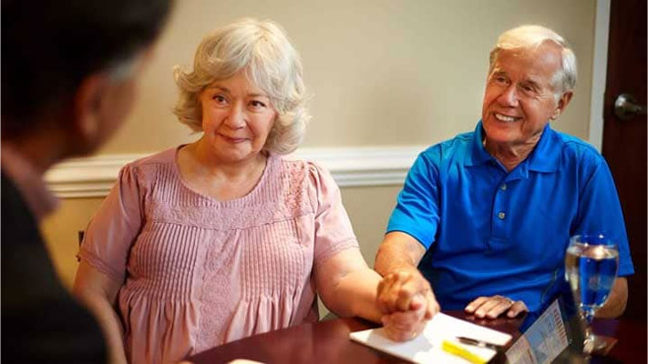 Couples Taking Advice from Retirement Planner